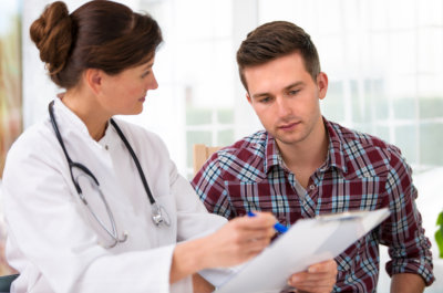 female nurse showing the clipboard to the man