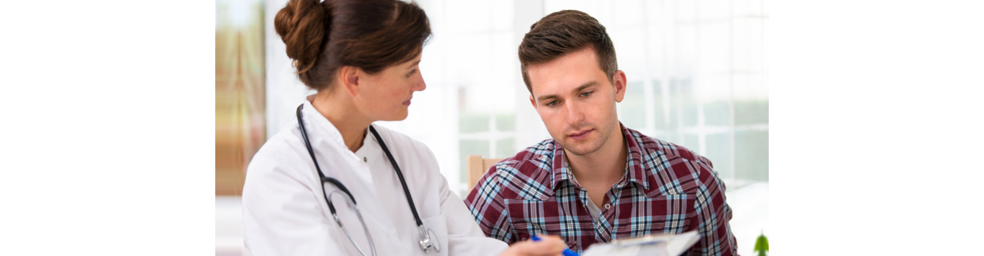 female nurse showing the clipboard to the man